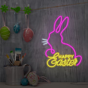 yellow happy easter bunny neon sign hanging on wall