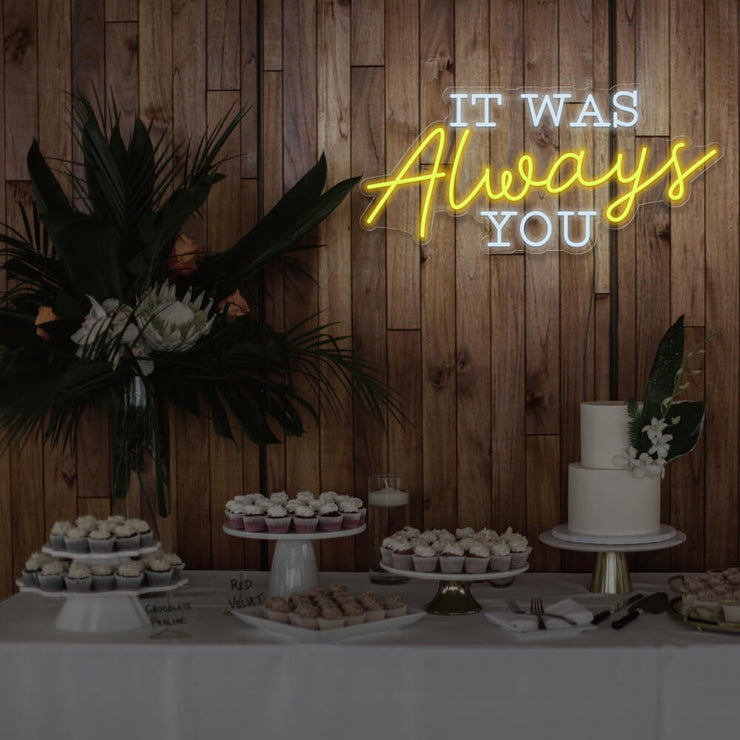 yellow it was always you neon sign hanging above dessert table