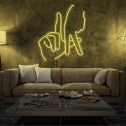 yellow LA fingers neon sign hanging on living room wall