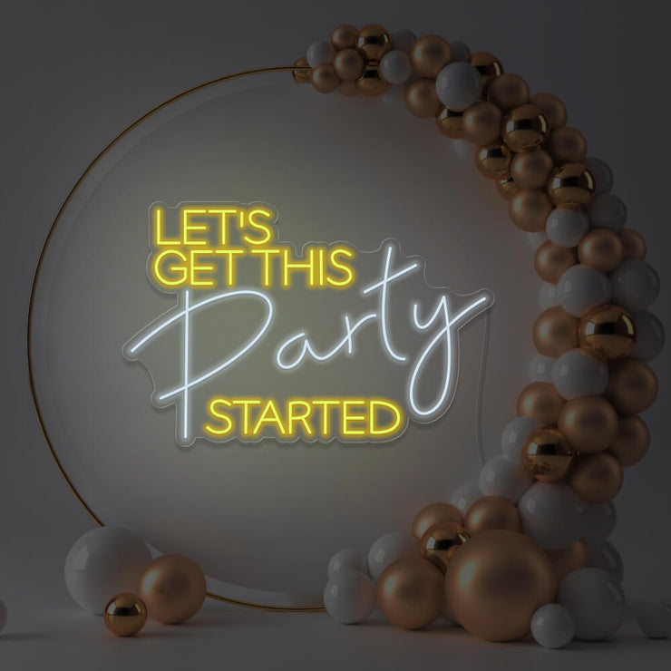 yellow lets get this party started neon sign hanging in gold hoop frame