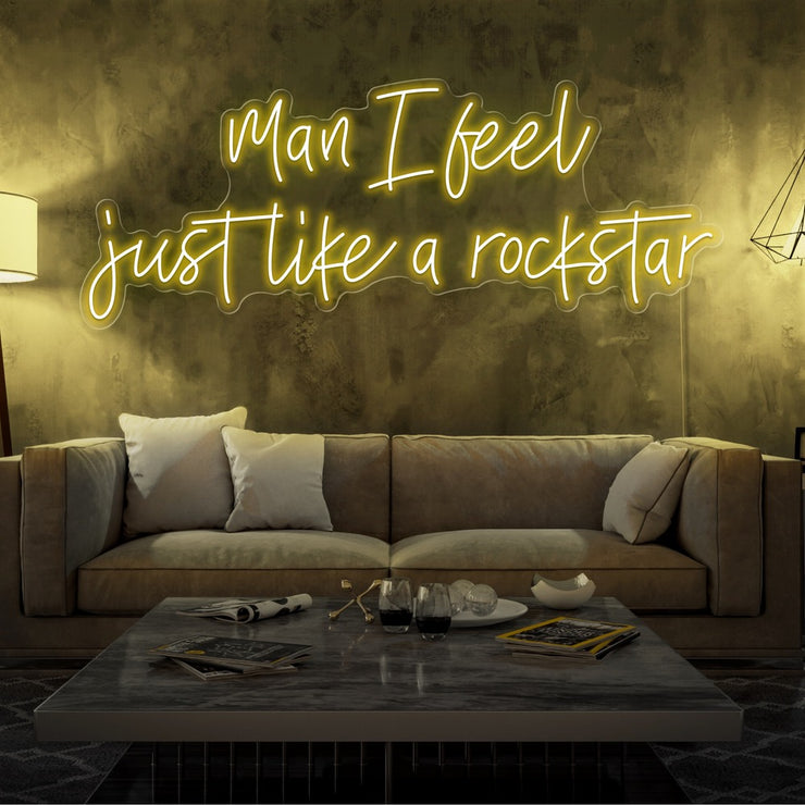 yellow man i feel just like a rockstar neon sign hanging on living room wall