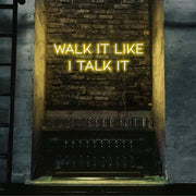 yellow walk it like i talk it neon sign hanging on bar wall